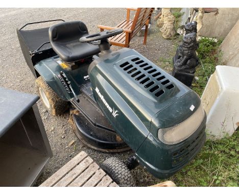 A Bolens ride-on-lawn mower with grass box, powered by a 12.5HP Overhead valve petrol engine starts, drives and cuts but exha