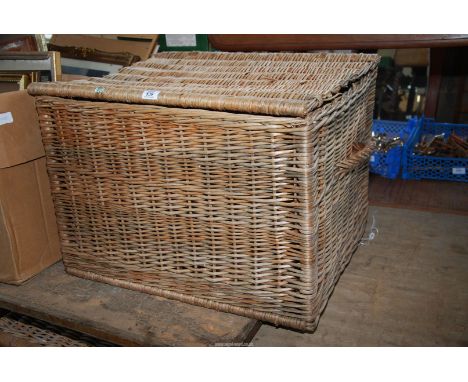 A large wicker trunk, 27'' x 20'' x 19'' high.