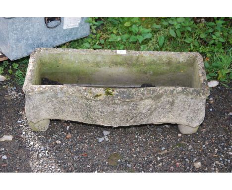 A raised oblong concrete planter, 29" x 12" x 11" high.