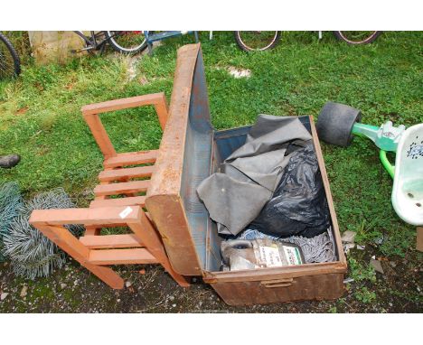 A trunk with nylon rope and a wooden seat.