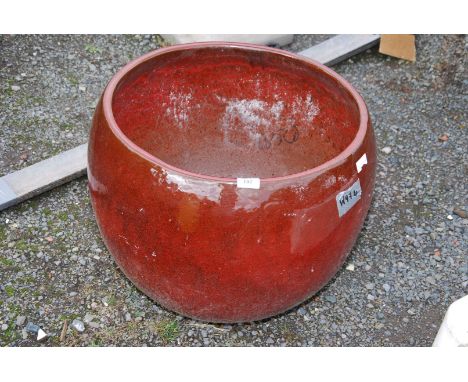 A glazed planter - 16½ high x 19" diameter.