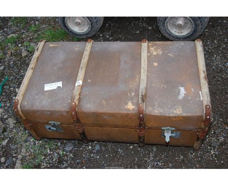 A bent-wood bound trunk.
