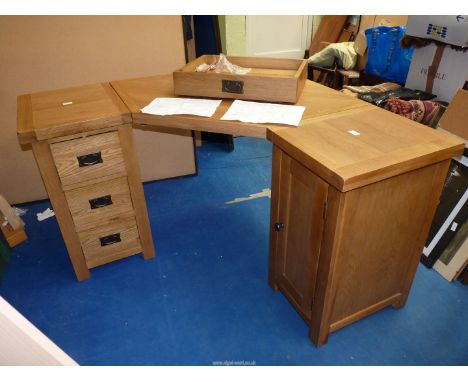 A light  oak corner office desk with storage drawers, cupboards plus a shelf to be fitted.