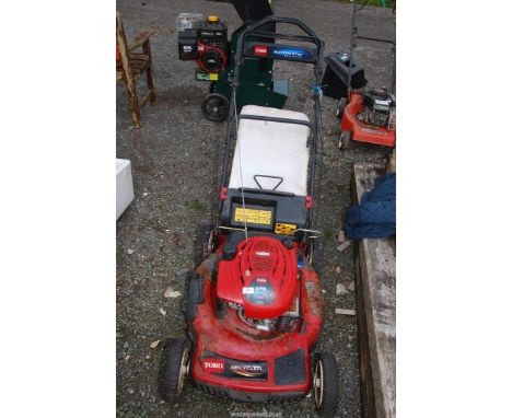 A 'Toro' propelled mower with 'Briggs and Stratton' engine - engine turns