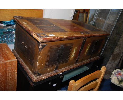 A vintage wooden trunk with metal brackets - 38" wide x 18" x 14" high.