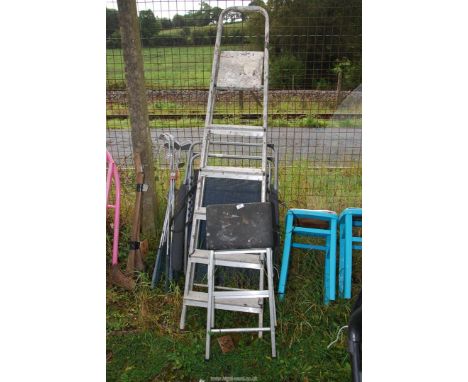 Two step ladders; one six rung, one two rung.
