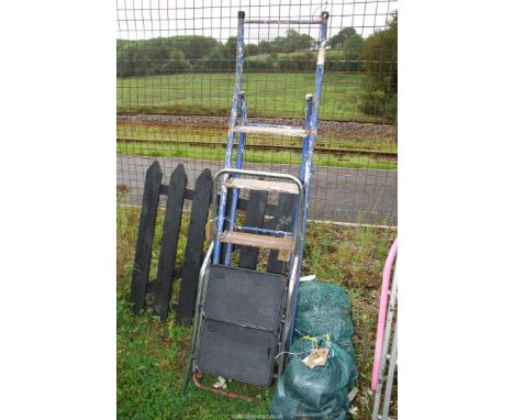 Two step ladders; one metal five rung, one two rung plastic footed.