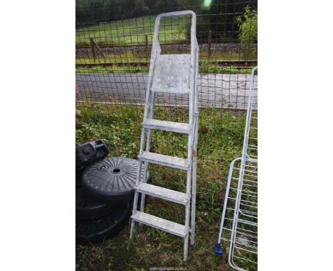 A five rung aluminium step ladder.