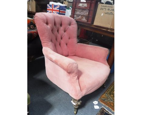 A VICTORIAN BUTTON BACK ARMCHAIR upholstered in pink velvet 