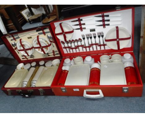 A VINTAGE 'SIRRAM' PICNIC SET in a red case and another similar by 'Brexton'