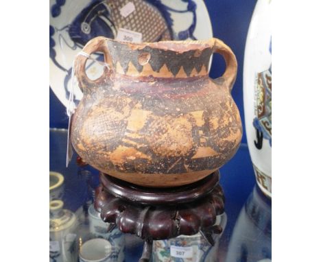 A PRE-COLUMBIAN STYLE TWO HANDLED CERAMIC VASE