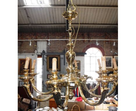 A GILT BRASS EIGHT BRANCH CHANDELIER with central vase-shaped column and eight scrolling branches, 20th century 30" wide  