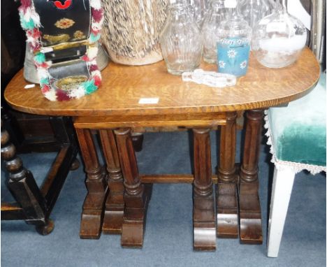 A NEST OF THREE LIGHT OAK TABLES