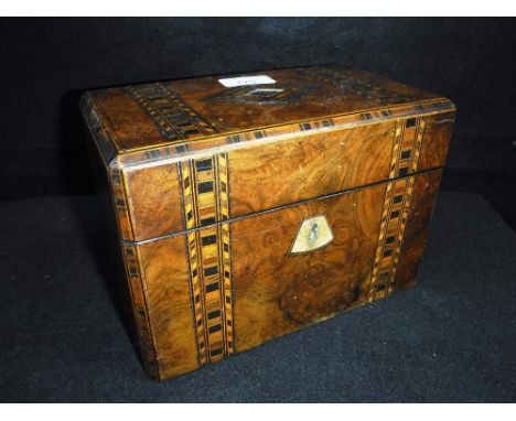 A VICTORIAN WALNUT AND PARQUETRY TEA CADDY