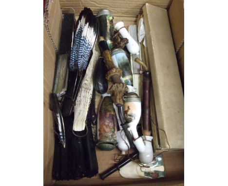A collection of eight various fans and five Continental ceramic pipes.