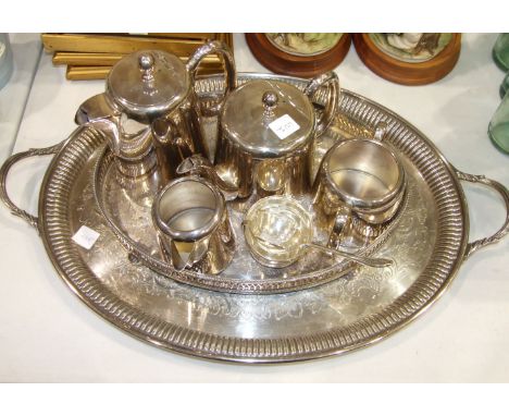 A silver tea strainer and stand, Sheffield 1935, 3oz, a plated tea service and trays.