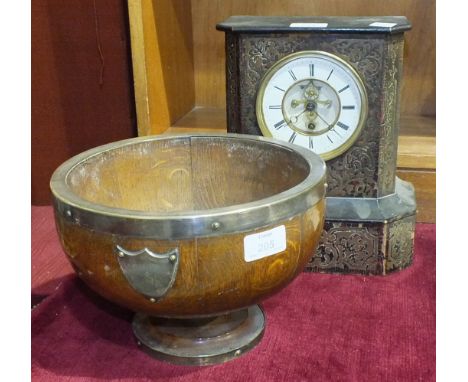 An oak circular bowl with plated mounts, (no liner), 24cm diameter, 16cm high and a wood case mantel clock with movement stam