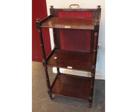 A George IV mahogany three-tier whatnot, the rectangular tiers and turned supports with rising fire screen back, 46cm wide, 9