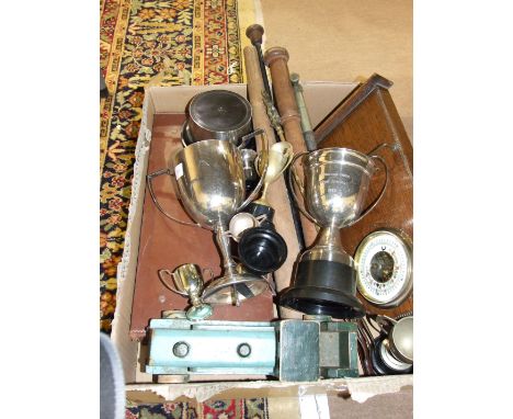 An aneroid barometer on wooden mount, various plated trophy cups and other items.