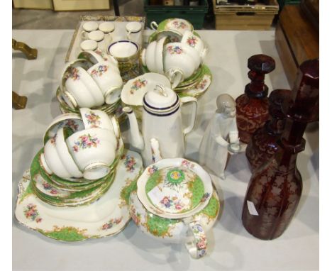 A part Paragon floral decorated tea service, 42 pieces, a Worcester part coffee can service, a Lladro figure and a red overla
