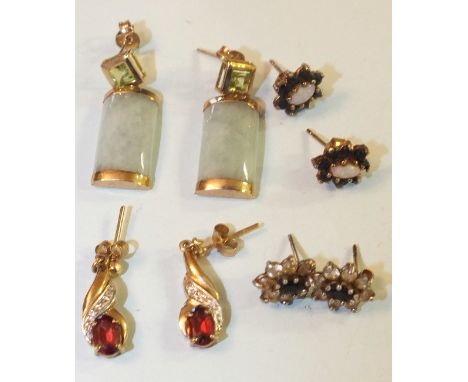 A pair of peridot and jade earrings with 9ct gold mounts and three other pairs of earrings, total wt 9g.