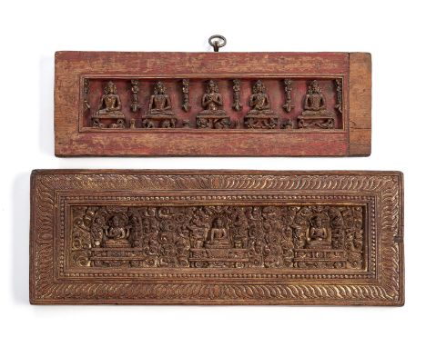 Vier Buchdeckel aus HolzTibet, 12. - 15. Jh. und später35 x 11,8 x 1,8/ 40,5 x 15,3 x 2,0/ 40 x 10,8 cmHartes Holz, rechter R