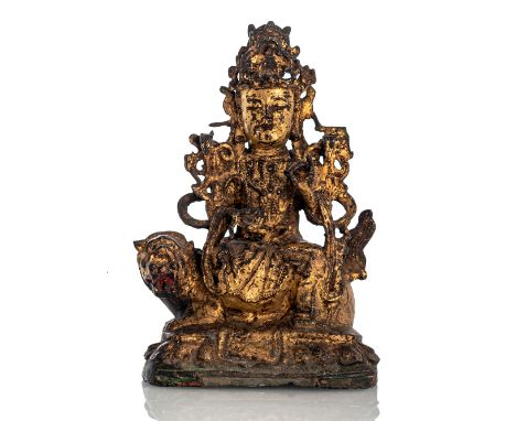 Bronze des Manjushri auf einem Löwen sitzendChina, 17. JhH. 23,5 cmIn europäischer Manier auf einem Löwen mit Kopfbedeckung s