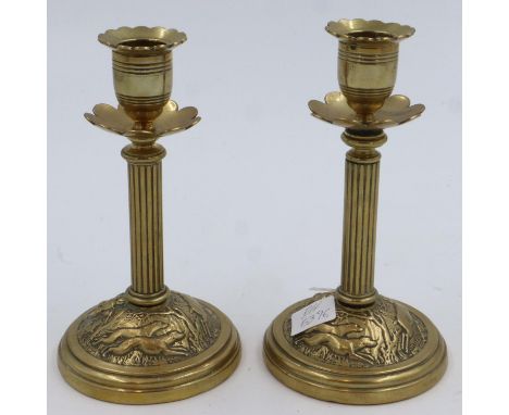 Pair of brass candlesticks with hunting scenes impressed, T&amp;T reg number 65361, H: 17 cm. UK P&amp;P Group 2 (£20+VAT for