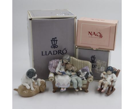 Two Lladro figures 05735, Big Sister, boxed, and 05448, Naptime, boxed, together with a Nao figure of two puppies at play, no