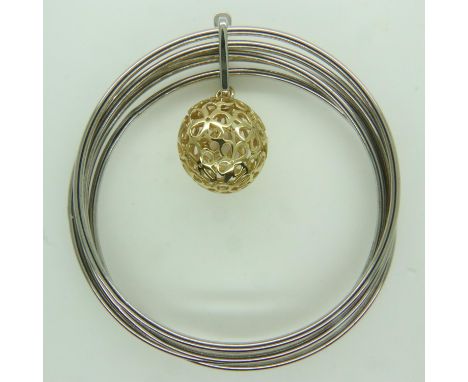 A contemporary Italian silver multi-sectional bangle with silver-gilt pierced ball charm, 25g. UK P&amp;P Group 0 (£6+VAT for