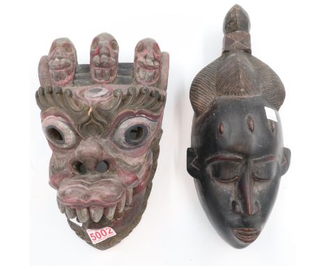 A tribal art wooden mask from Cameroon and another depicting far eastern dragon mask. UK P&amp;P Group 2 (£20+VAT for the fir