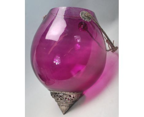 A vintage 20th century purple glass Moroccan porch lantern light shade. The glass shade of a bulbous form with purple painted
