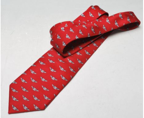 Automobile Interest - A vintage original Bentley tie having a burgundy background and featuring a repeating motif of the icon