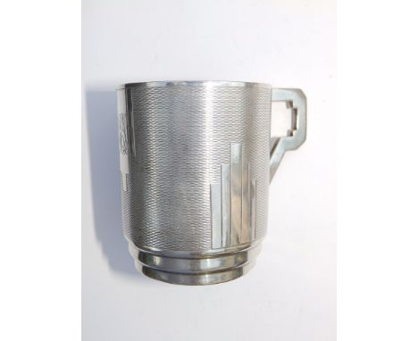 An art deco engine turned silver christening mug 