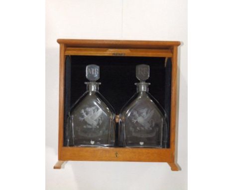 A pair of Orrefors heraldic decanters –'1962-1982', 'RB' & 'MB' to stoppers, 11” in oak tambour case – 'JAYNES' 