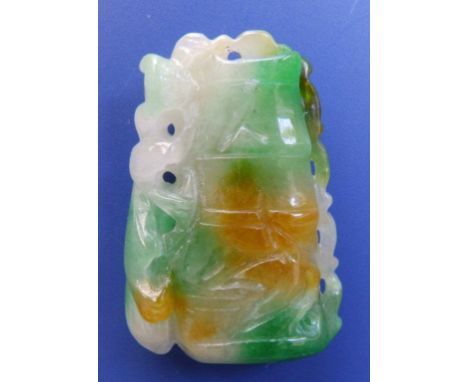 A variegated openwork jade pendant, 1.9” SEE ILLUSTRATION