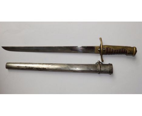 An Asian military dagger , with sunray pattern to hilt, in metal scabbard, 17.5” overall 