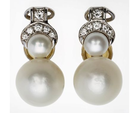 Paar gr. Perl-Ohrclips m. Brillanten.18 kt WG, jew. besetzt m. 1 gr. u. 1 kl. weißen Perle sowie 6 Brillanten v. zus. ca. 0,4