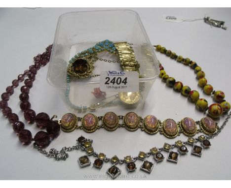 A quantity of vintage costume jewellery including beads and bracelets