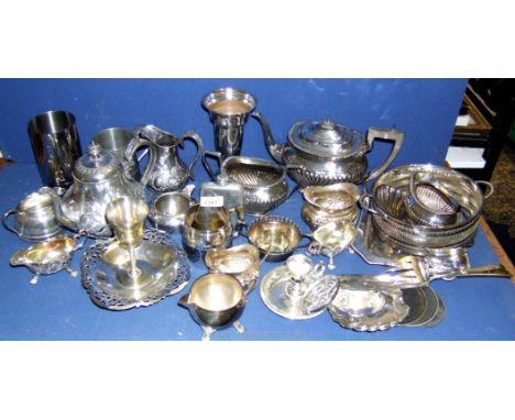 A large quantity of miscellaneous silver plated items to include milk jugs, teapot, serving slices, hip flask, etc