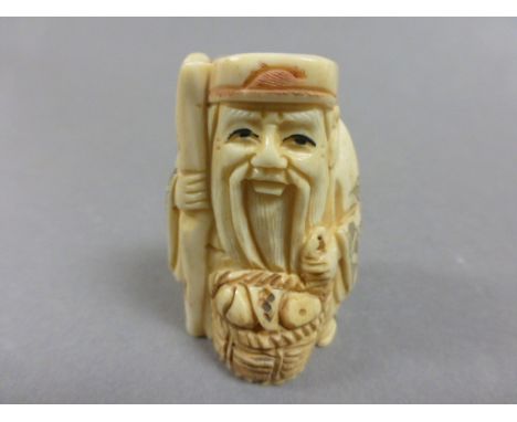 Signed oxbone netsuke of an old man with basket