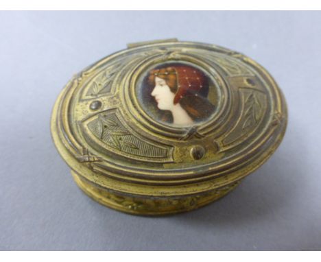 Late 19th / Early 20th century Gilt Metal Oval Box, the hinged lid set with an Enamelled Portrait of a Young Woman, marked to