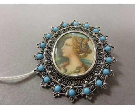 Miniature Portrait of a Young Girl set in an 800 grade Silver Filigree Frame with turquoise cabouchons 