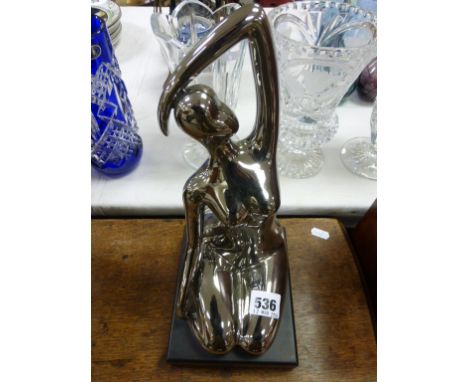 Ceramic art deco style figure on stand  