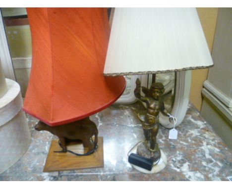 Cast Metal Cherub Table Lamp together with a Carved Wooden Buffalo Table Lamp