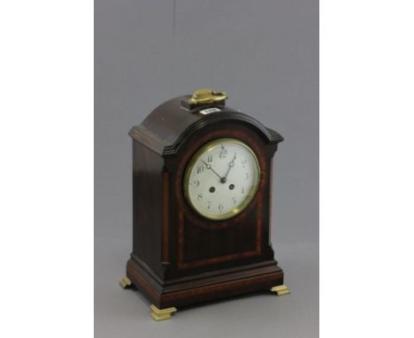 Edwardian Mahogany Inlaid Bracket Clock with brass handle to domed top and raised on four brass feet