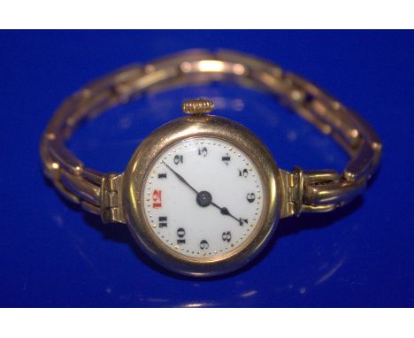 Ladies 9ct Gold Wristwatch, White Enamelled Dial, arabic Numerals, Manual Wind. Early 20thC