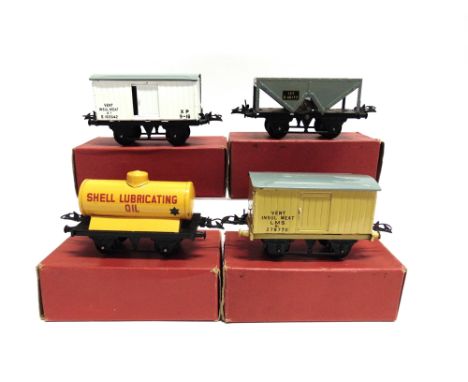 [O GAUGE]. FOUR HORNBY WAGONS  comprising a Tank Wagon 'Shell Lubricating Oil'; L.M.S. Meat Refrigerator Van, buff; 13-Ton Ho