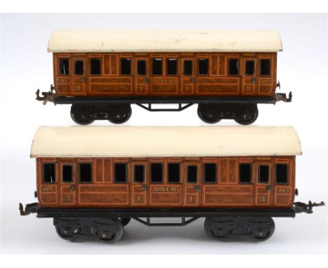 [O GAUGE]. A PAIR OF BING L.N.E.R. FIRST-THIRD COMPOSITE COACHES  both numbered 265, with a lined teak effect livery, unboxed