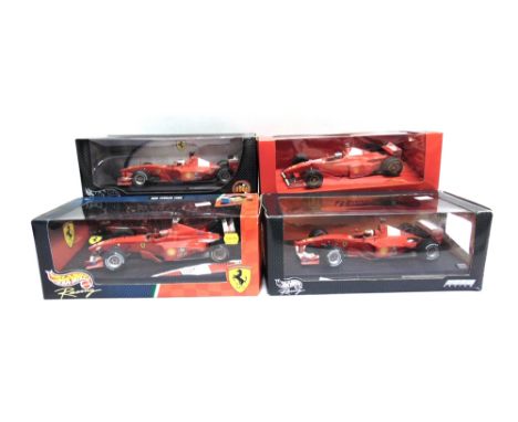 FOUR 1/18 SCALE FERRARI FORMULA 1 RACING CARS  comprising a Minichamps Ferrari F310/3 (M. Schumacher); Hot Wheels Ferrari F20